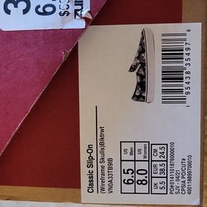 Vans slip on sneakers  size 6.5 mens size 8 womens  dark blue with  skull design